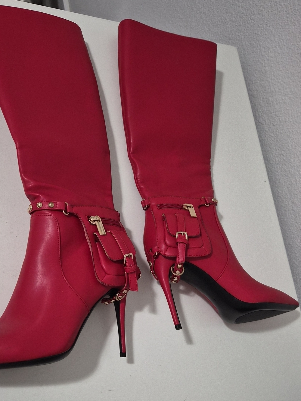 Red Knee-High Stiletto Boots with Gold Buckle Accents